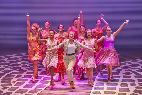 Melissa Nettleford, Lucy May Barker, Sophie Matthew, and the cast of MAMMA MIA! Photo