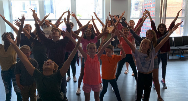 Kim Exum (BOOK OF MORMON) warms up with the Kids & Teens and teaches them a movement  Photo