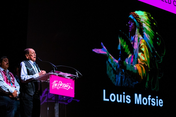 Center: Louis Mofsie accepting his 2019 Bessie for Outstanding Service to the Field o Photo