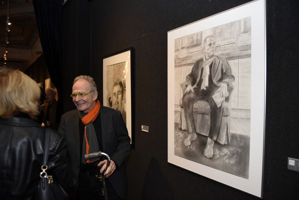 Ron Rifkin with his portrait at Joseph Feury''s Fioretti: Through the Window exhibit. Photo