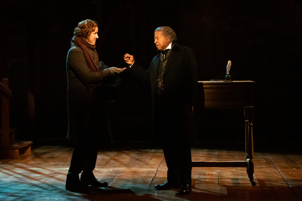 Chris Hutchison as Bob Cratchit and David Rainey as Scrooge  Photo