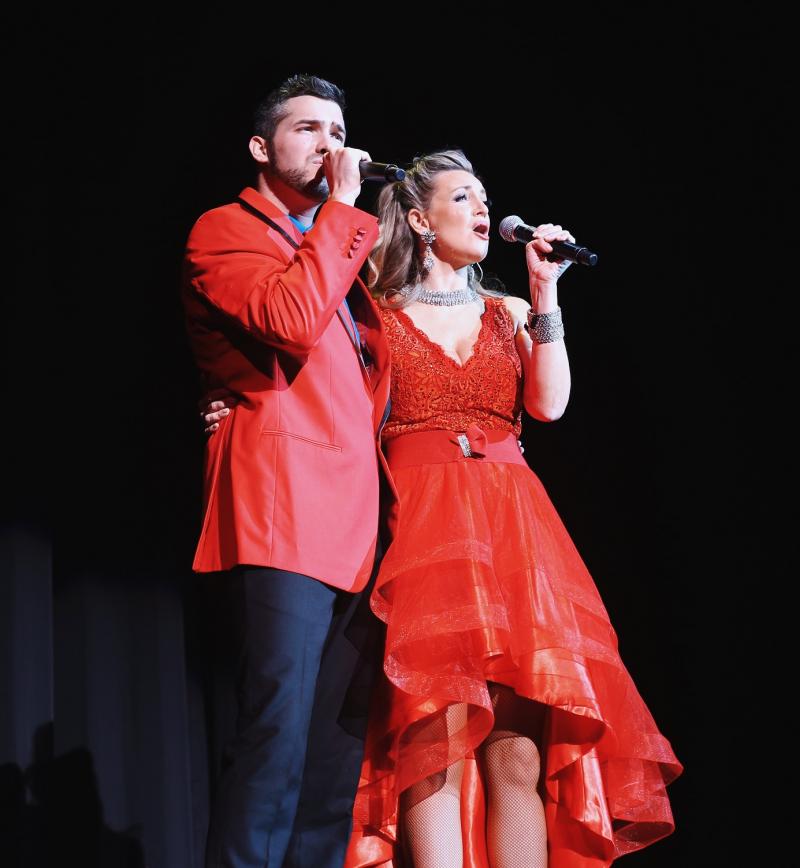 a male and a female singer onstage