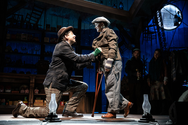 Billy Butler as Bob Cratchit and Sachie Capitani as Tiny Tim
 Photo