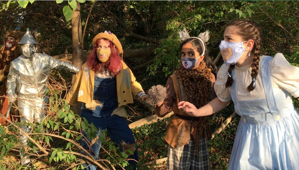 Members of the combined Ensemble perform The Wizard of Oz in BTC?s backyard. Photo