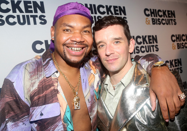 NEW YORK, NEW YORK - OCTOBER 10: Devere Rogers and Michael Urie pose at the opening n Photo
