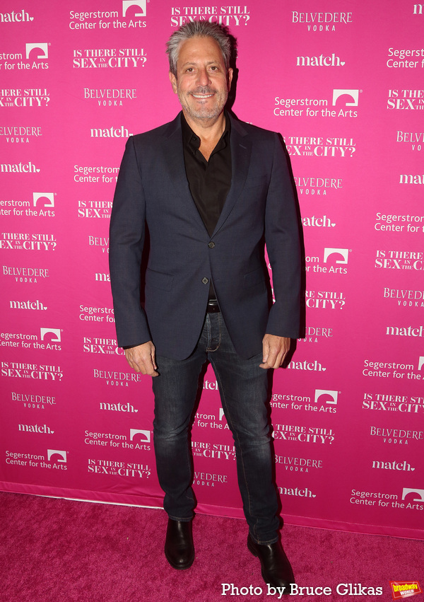 Darren Star poses at the opening night of the new Candace Bushnell one-woman show 