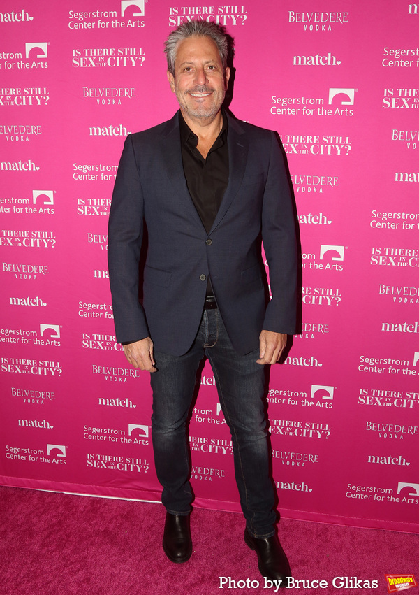 Darren Star poses at the opening night of the new Candace Bushnell one-woman show "Is Photo