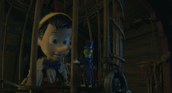 Pinocchio (voiced by Benjamin Evan Ainsworth) and Jiminy Cricket (voiced by Joseph Go Photo