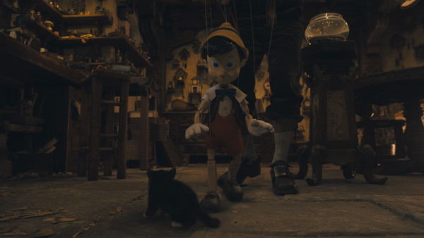 Figaro and Pinocchio (voiced by Benjamin Evan Ainsworth) in Disneys live-action PINOCCHIO, exclusively on Disney+.