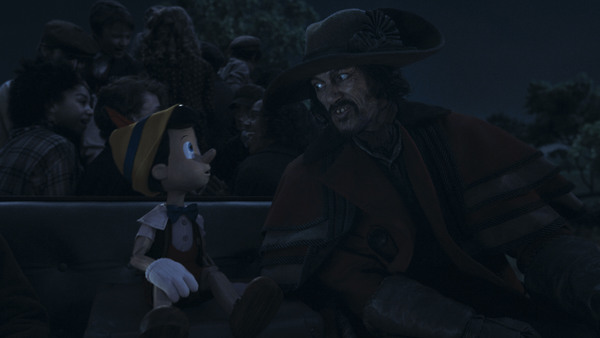 Pinocchio (voiced by Benjamin Evan Ainsworth) and Luke Evans as The Coachman in Disne Photo