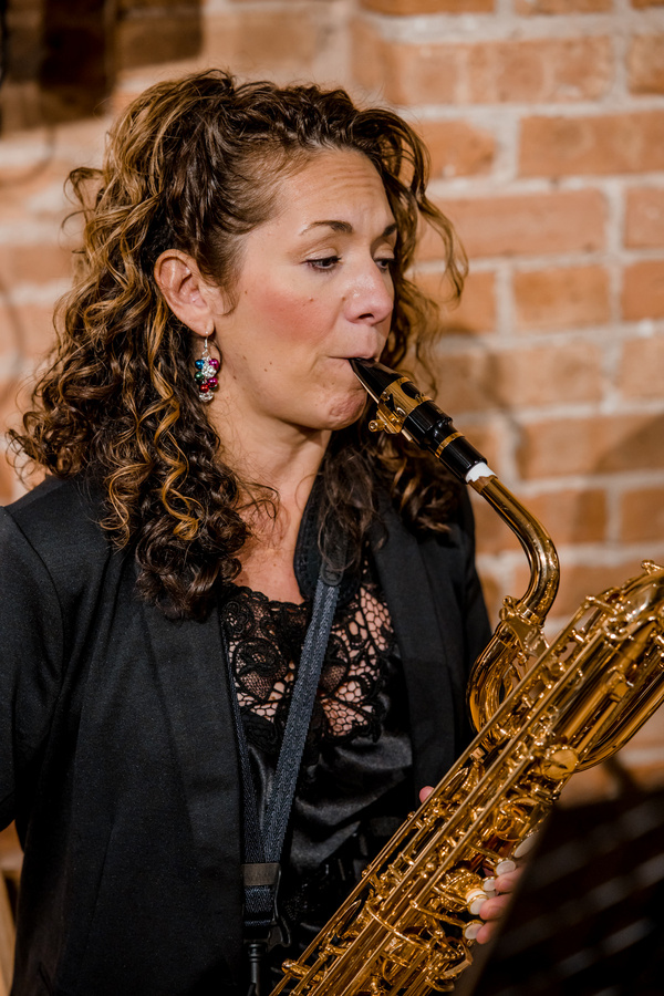 Lara Regan on Baritone Sax. (Photo by Elizabeth Stenholt) Photo