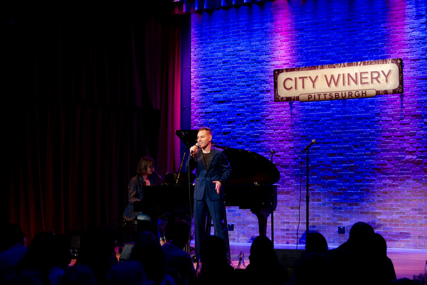 Travis Moser performing the opening number, Mountain Girl.  Photo