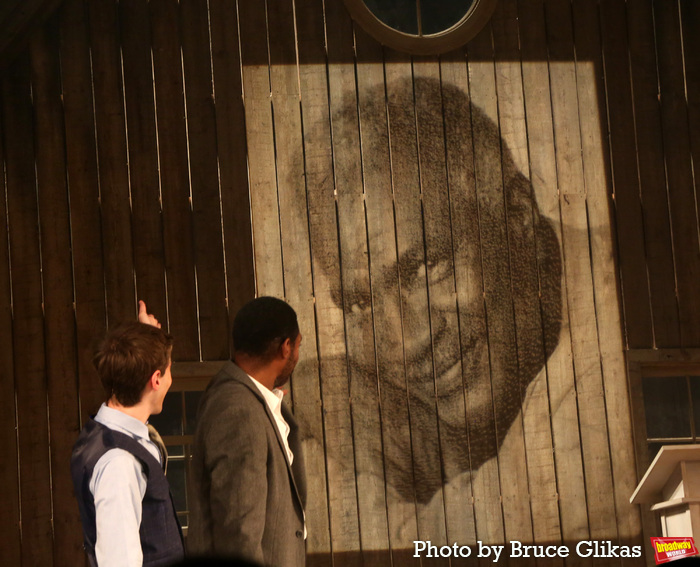 Noah Robbins, Billy Eugene Jones with a Projection of Playwright Ossie Davis Photo