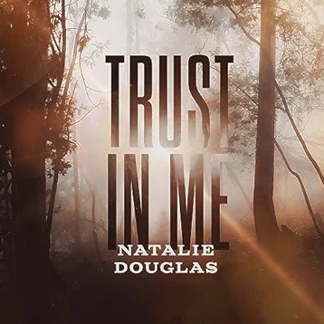 Music Review: Singer Sings A Sexy, Slinky, Slithery Single With Natalie Douglas' New Release TRUST IN ME Image