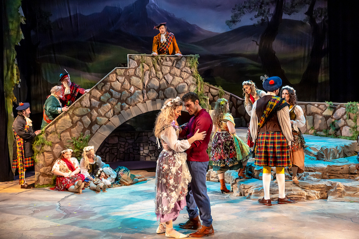 Foreground: Sarah Obert and Conor Jordan with members of the BRIGADOON cast Photo