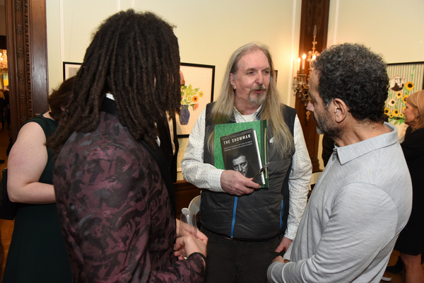 Queens Public Library curator Daniel Zaleski and Tony Shalhoub chat. Photo