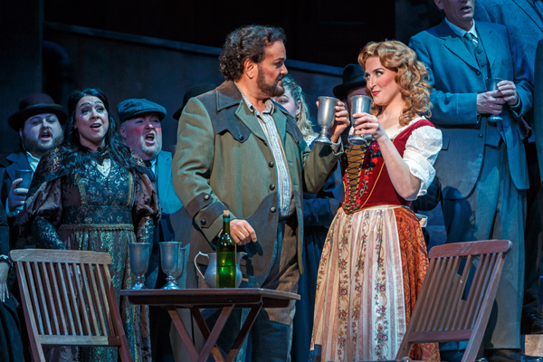 Turiddu (Rafael Davila) toasts his married mistress Lola (Audrey Welsh) Photo