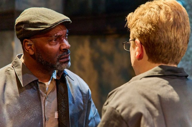 Red and Andy have a conversation in NextStop's production of The Shawshank Redemption