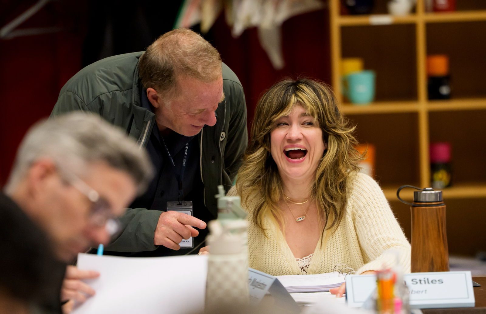 Photograph of Sarah Stiles in rehearsal for Iceboy! with castmate Jay Reiss. Sarah is laughing and facing the camera, while Jay looks at her with a smile on his face.
