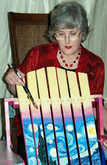 Artist Portia A. Bell, seen here with her Starry Night Rocker, has donated this work  Photo