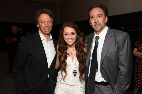 Producer Jerry Bruckheimer, Miley Cyrus and Nicolas Cage Photo