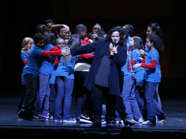 A parting shot of Rosie with her Broadway Kids embracing Queen Latifah Photo