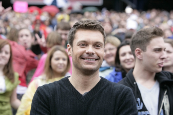 Ryan Seacrest welcomes Boston auditioners as they arrive for their chance to become t Photo