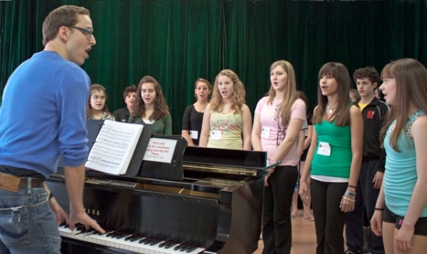 Trent Kowalik and students learn vocals to the finale of Billy Elliot Photo