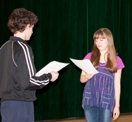 Trent Kowalik reads a side from Billy Elliot with a student Photo