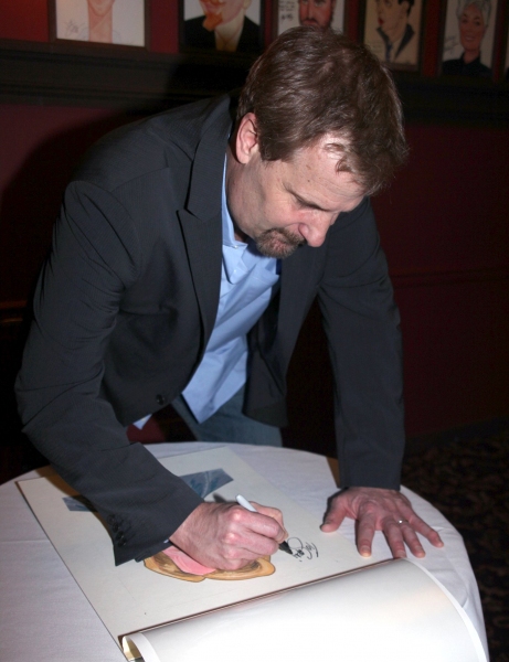 Jeff Daniels Signs his Portrait Photo