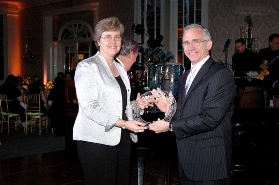 Ann Borowiec receives the Samuel Campbell Award from Mark S. Hoebee Photo