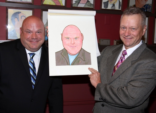 Max Klimavicius presents Kevin Chamberlin with his new caricature! Photo
