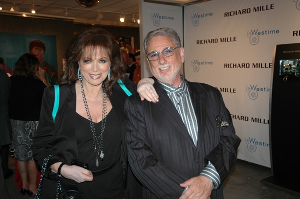 Jackie Collins poses with manager Barry Krost. Photo
