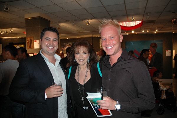 Jackie Collins poses with Art Project Los Angeles VIP guests. Photo