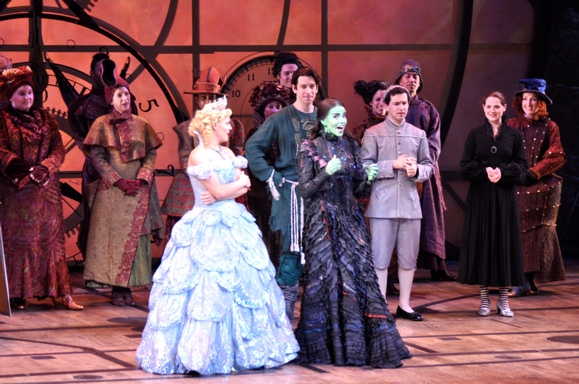 Katie Rose Clarke and Mandy Gonzales and the cast of Wicked announce the lucky winner Photo