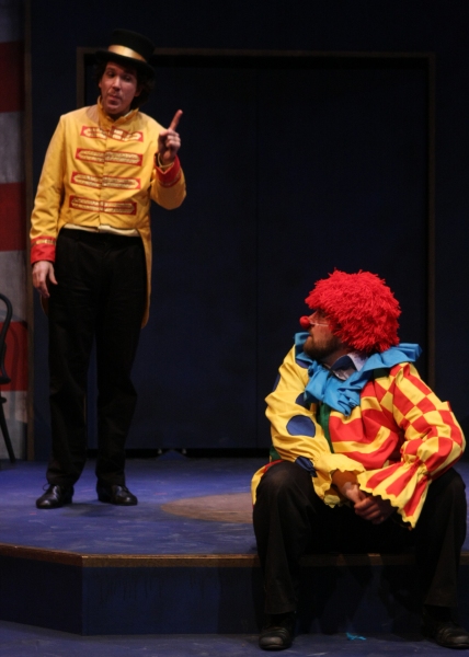 Beppo the clown (Matt Erkel) gets scolded by The Ringmaster (Paul de Cordova) for cau Photo