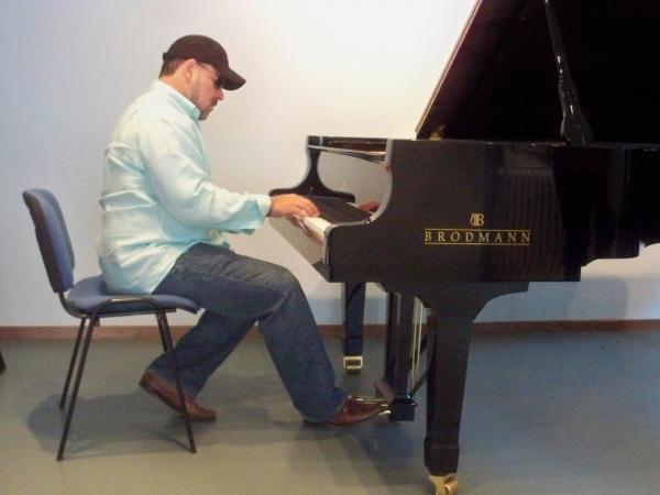 Frank Wildhorn practicing on a Brodman piano Photo