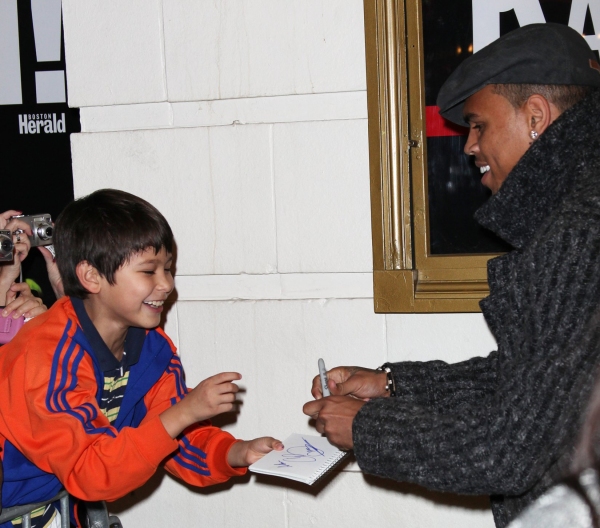 Chris Brown with a young fan Photo