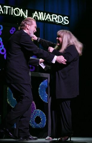 Harry Groener (L) greets actress Sally Struthers Photo
