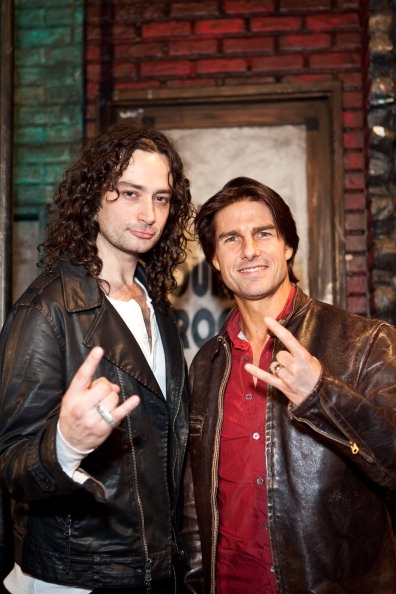Constantine Maroulis (L) and Tom Cruise (R) pose onstage for "Rock of Ages" at the Pa Photo