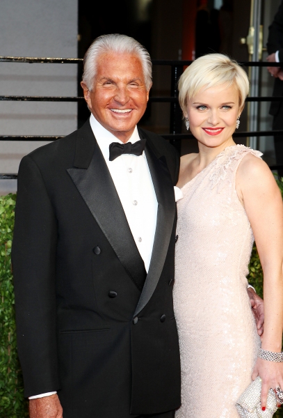 George Hamilton and Barbara Sturm pictured at The Vanity Fair Oscar Party at Sunset T Photo