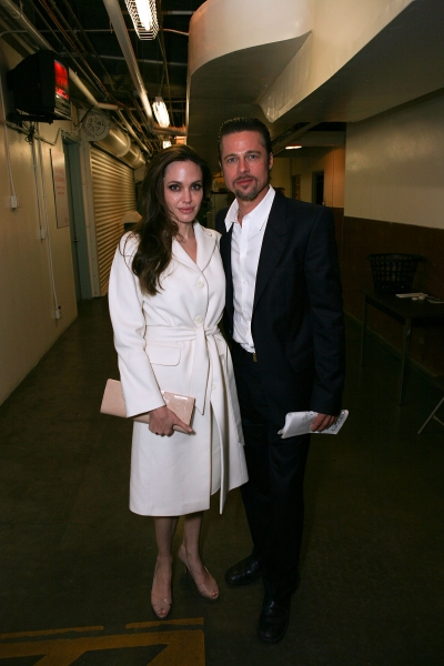 LOS ANGELES, CA - APRIL 13: Actors Angelina Jolie (L) and Brad Pitt (R) pose backstag Photo