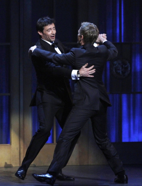Hugh Jackman dances with host Neil Patrick Harris during the American Theatre Wing's  Photo