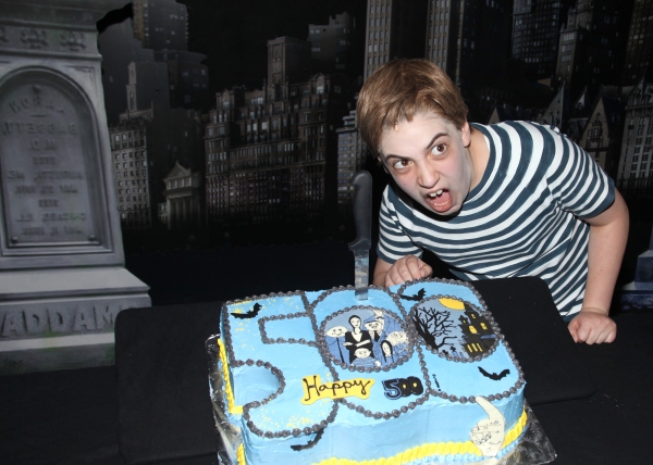 Adam Riegler with the cast of 'The Addams Family' celebrating their 500th performance Photo