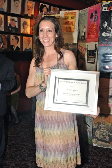 Lori Fineman (Executive Director of The Transport Group) accepting the awarad for Bes Photo