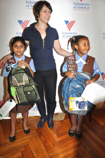 Paige Davis and Local Girl Scouts help fill backpacks Photo