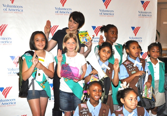 Paige Davis and Local Girl Scouts help fill backpacks Photo