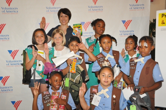 Paige Davis and Local Girl Scouts help fill backpacks Photo