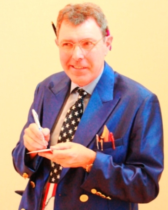 David Radcliffe as the IRS Agent Photo
