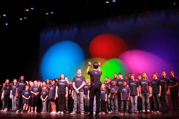 Paul Canaan conducts the cast of "True Colors"
 Photo